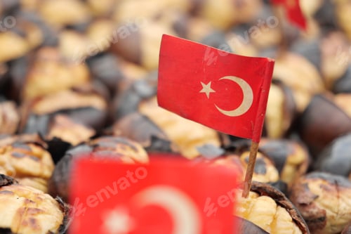 Preview: turkish flag on traditional Istanbul street food grilled chestnuts in a row
