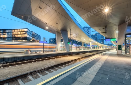 Preview: High speed train in motion on the railway station at night