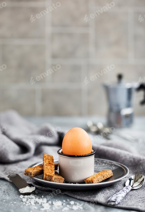 Preview: Boiled egg with rye toasts for breakfast