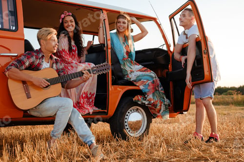 Preview: Hippie friends with guitar on a road trip