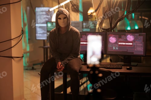 Preview: Cyber criminal in mask hacking password, breaking computer system