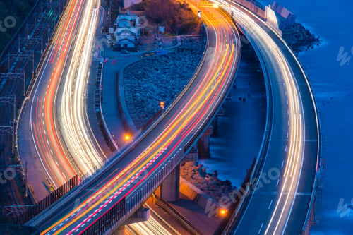 Preview: Aerial view of cars driving on highway junctions. Bridge roads shape in connection of architecture