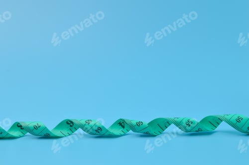 Preview: Tape measure isolated on a blue background