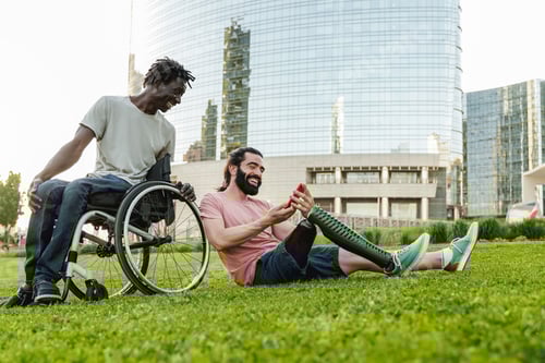 Preview: Two Men Relaxing on Green Lawn in City