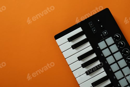 Preview: Midi keyboard on orange background, space for text