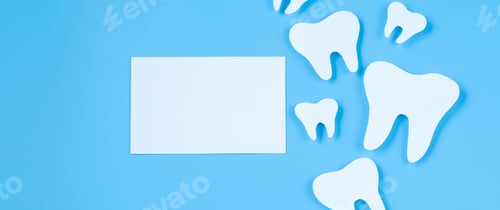 Preview: Paper cut mockup of tooth on blue background. Dental care concept. International Dentist Day.