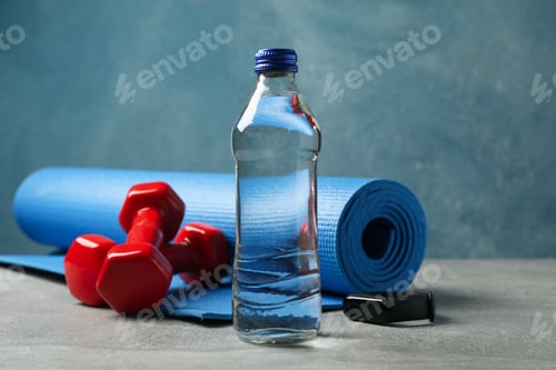 Preview: Fitness accessories on gray table, close up. Healthy lifestyle