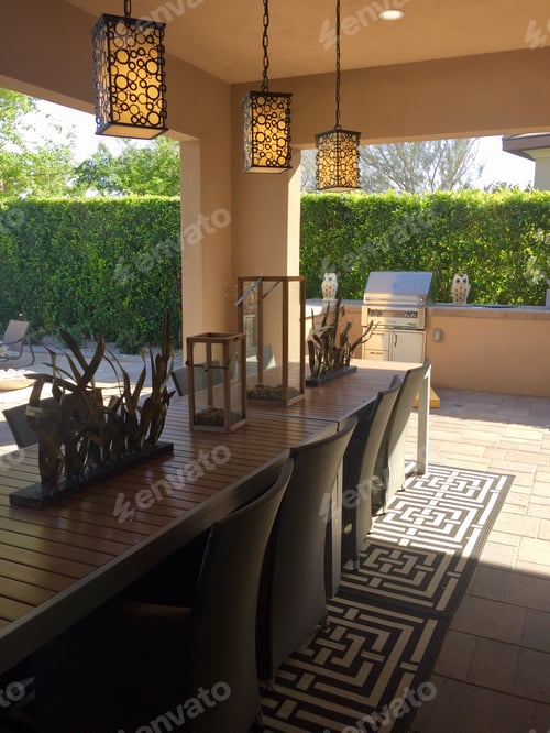 Preview: Outdoor dining table and chairs on a porch