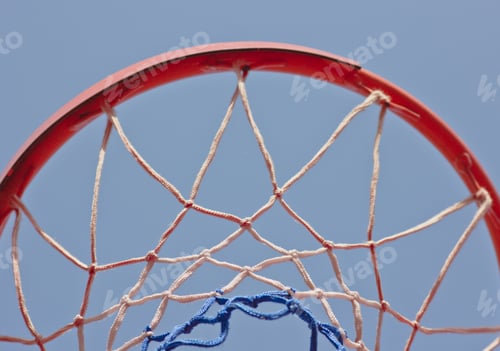 Preview: Close-up basketball hoop rim, up ward view a hoop under blue sky