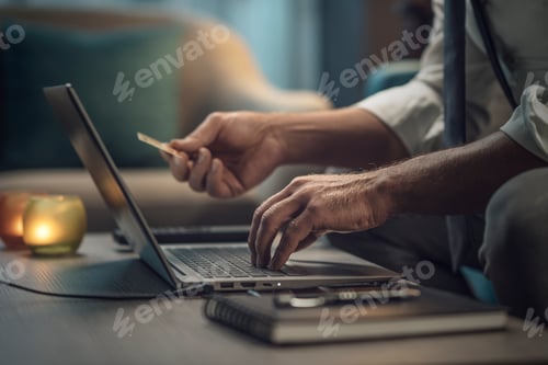 Preview: Businessman using a credit card online