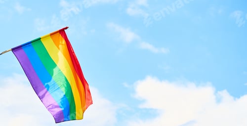 Preview: LGBT flag against blue sky