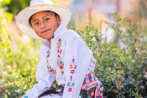 Preview: Young boy wearing traditional clothes celebrating national festivity outdoors. Dia de la hispanidad