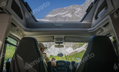 Preview: Tourist Inside a Modern Camper Van RV with Panoramic Windows