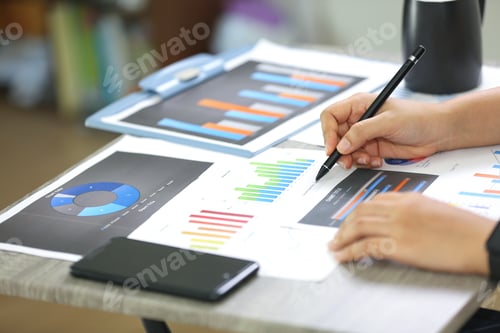 Preview: Marketing charts and data paper work on table