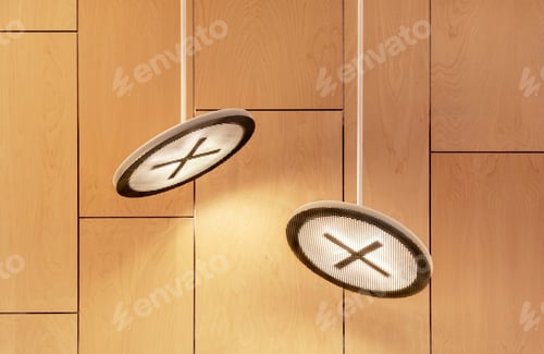 Preview: Two modern ceiling lamps against wooden wall indoors