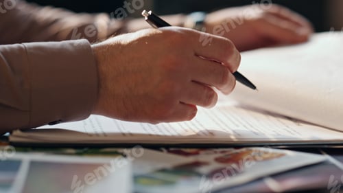 Preview: Closeup businessman hand signing contract at office table. Man putting signature