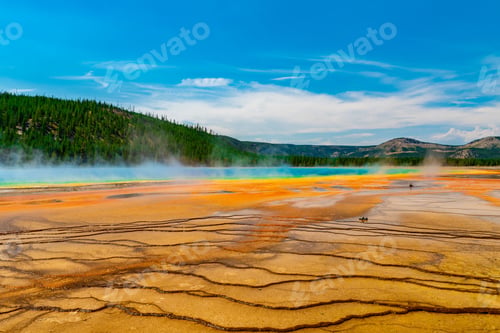 Preview: Beautiful shot of The Grand Prismatic Spring in Yellowstone National Park under a blue sky