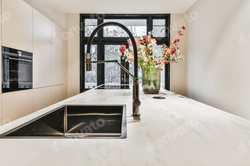 Modern Kitchen Island with Marble Countertop and Black Sink