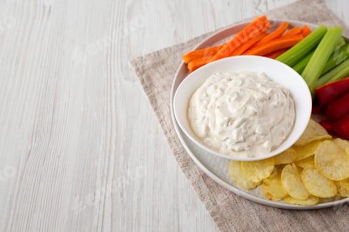 Preview: Homemade Caramelized Onion Dip with Potato Chips, Celery, Pepper and Carrot.