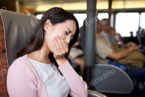 Preview: Woman feeling unwell and sitting on the ferry