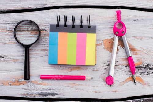 Preview: Colored notepad with pink pencil and dividers.