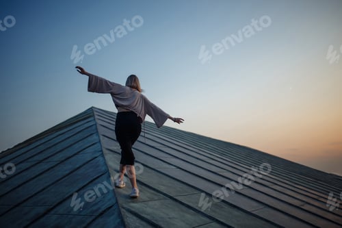 Preview: Young woman in roof enjoying sunset, freedom city atmosphere. People, lifestyle, relaxation concept.