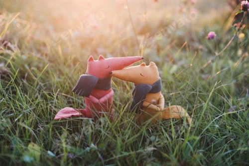 Preview: Cute little handmade toy fox in green grass. Childhood, baby, holiday, people, hobby, emotions