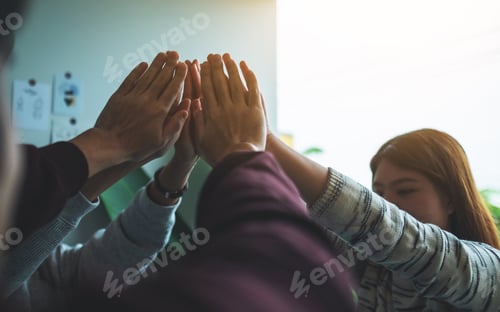 Preview: A group of young people putting their hands together