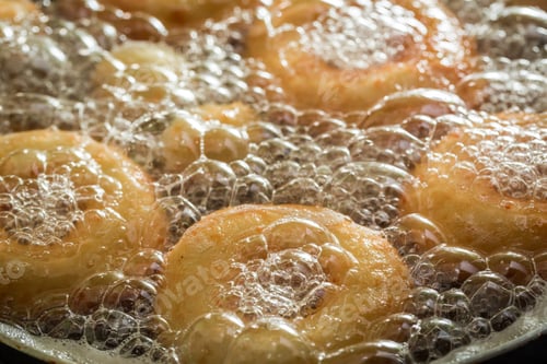Preview: Frying tasty and homemade donuts on hot oil