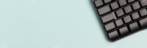 Preview: Laptop keyboard on a blue background. Concept: freelance, work from home.