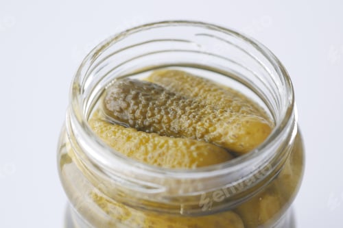 Preview: bottle of pickled cucumbers, pickles on table
