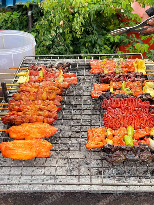 Preview: Grilled pork shashlik kebabs on barbecue outdoors at back yard. Meat lamb kebab on BBQ. Barbecue shi