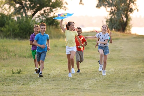 Preview: Cute little children playing with kite outdoors