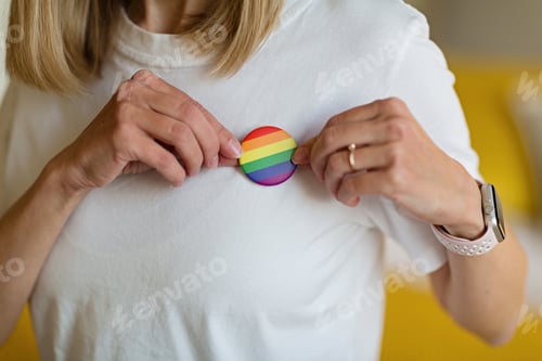 Preview: Stylish Woman in white shirt with the LGBT pride flag sign. Concept of the Pride day, Valentine day