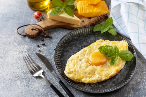 Preview: Baked cottage cheese pumpkin bread with cheese and egg filling on stone background.