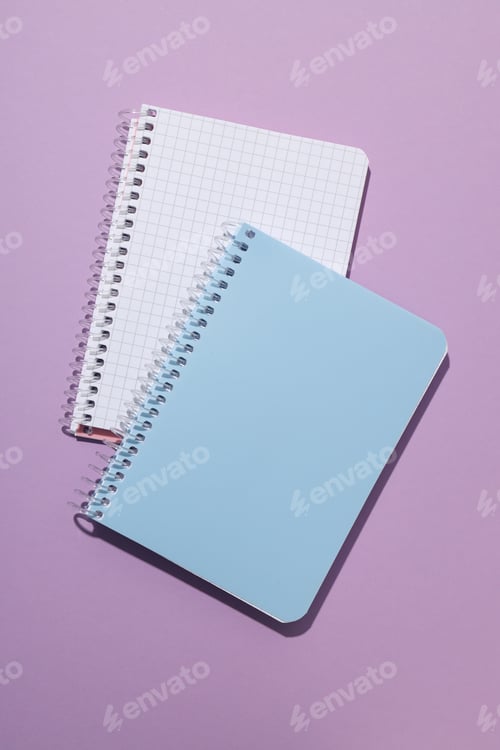 Preview: Two notebooks lie on a purple background