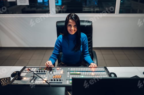 Preview: Middle aged woman using equipment in control room on a tv station