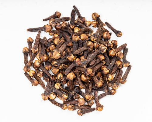 Preview: pile of whole dried cloves close up on gray