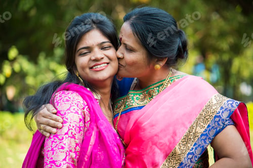 Preview: Portrait of happy mother and daughter embracing.
