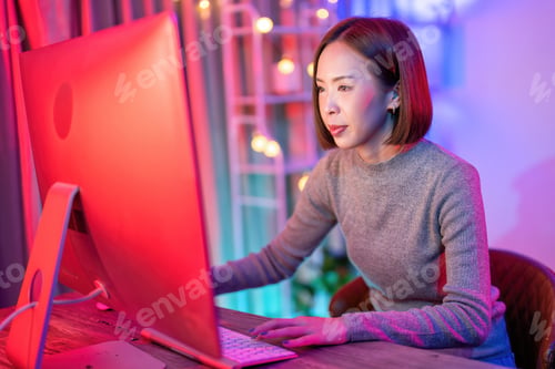Preview: At home game player wearing headset have fun play battle streaming online game