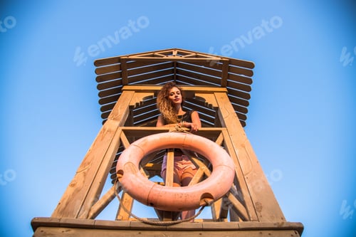 Preview: Girl With Long Curly Hair Standing On The Observation Deck Rescue