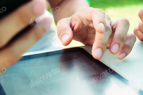 Preview: image of hand using digital tablet close up