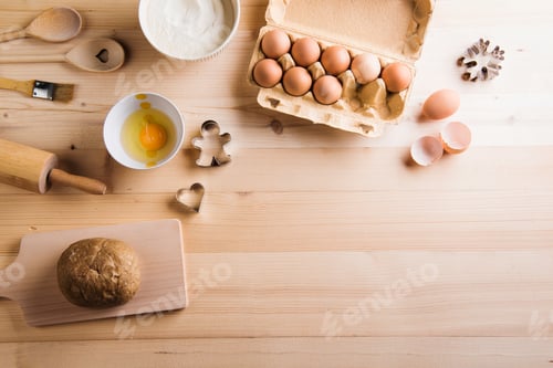 Preview: Baking ingredients and kitchen utensils. Wooden backround. Copy