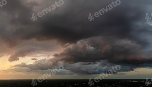 Preview: Stormy cumulus clouds forming during heavy thunderstorm on dark sky.
