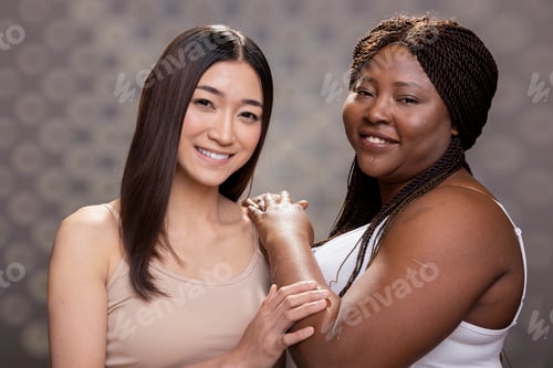 Preview: Confident graceful diverse friends posing with radiant healthy skin