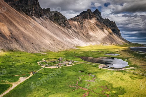 Preview: Abandoned viking village with Vestrahorn mountain on wilderness in summer Iceland