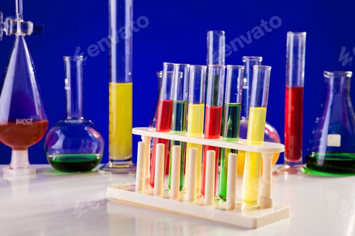 Preview: Chemistry lab equipment on a table over blue background
