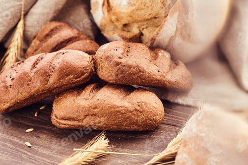 Preview: Delicious freshly bakery products on wooden background.