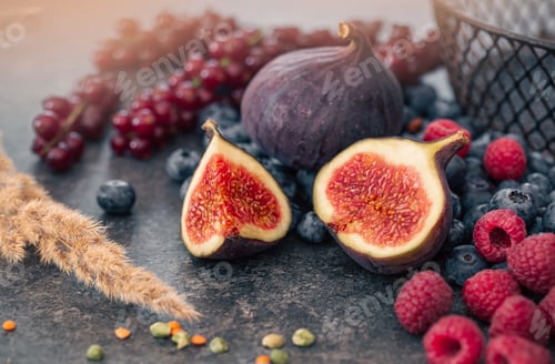 Preview: Close-up, figs in the cut among the berries.