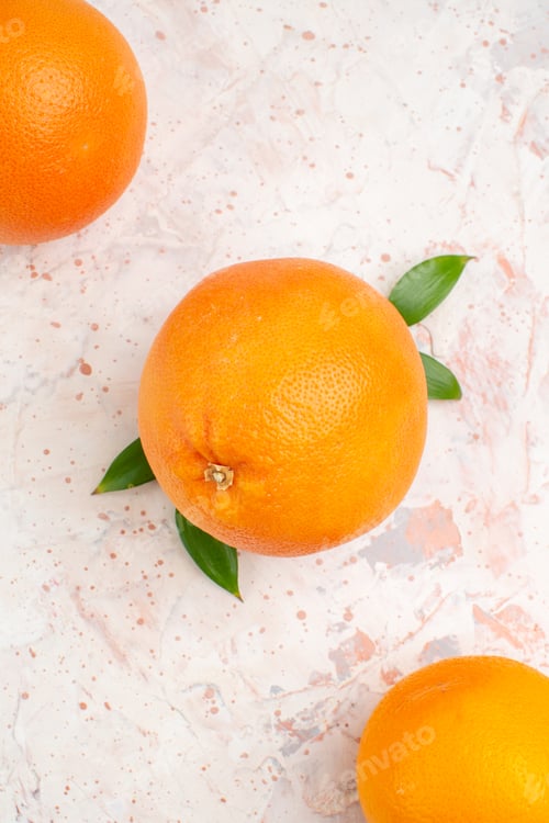 Preview: top view fresh oranges on bright isolated background